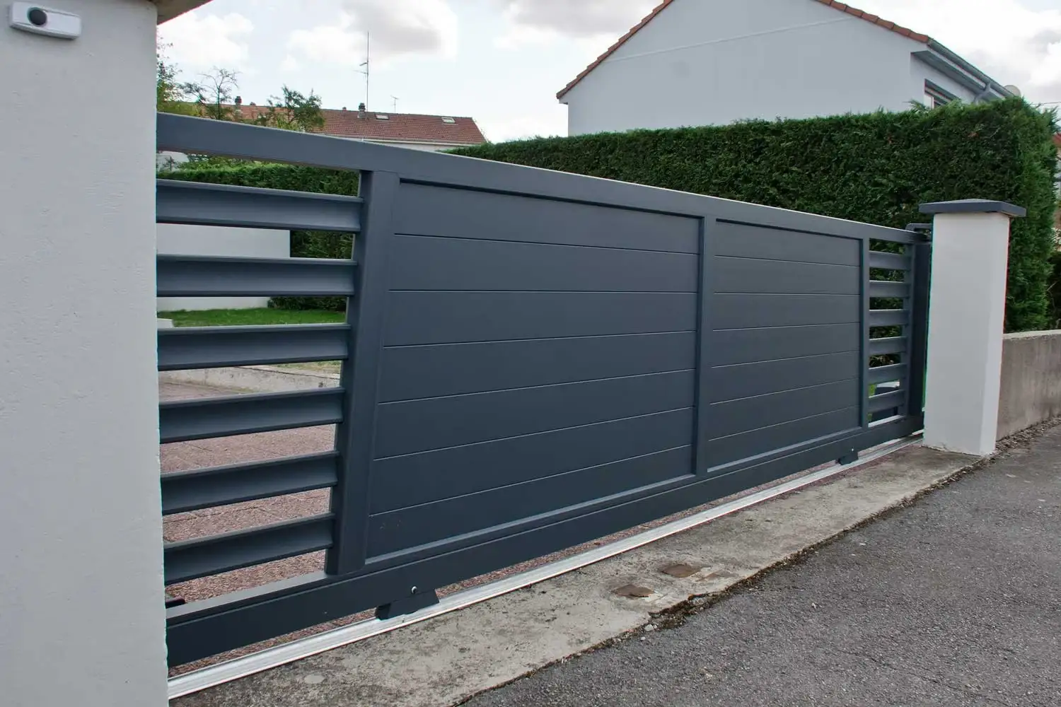 Sliding gate on a suburban driveway