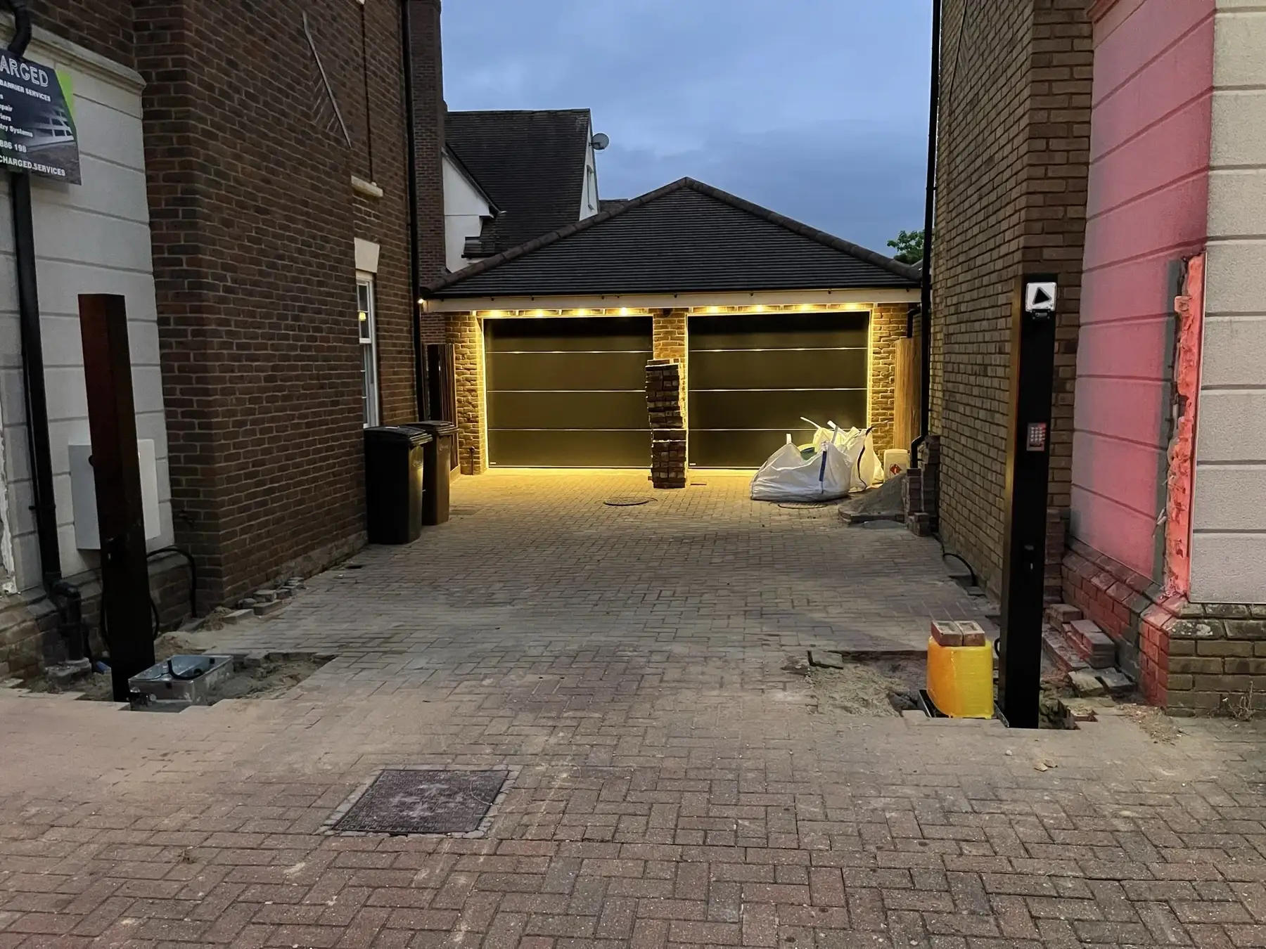 Gate being installed on a new-build driveway