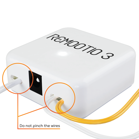 Remootio unit mounted with double-sided tape